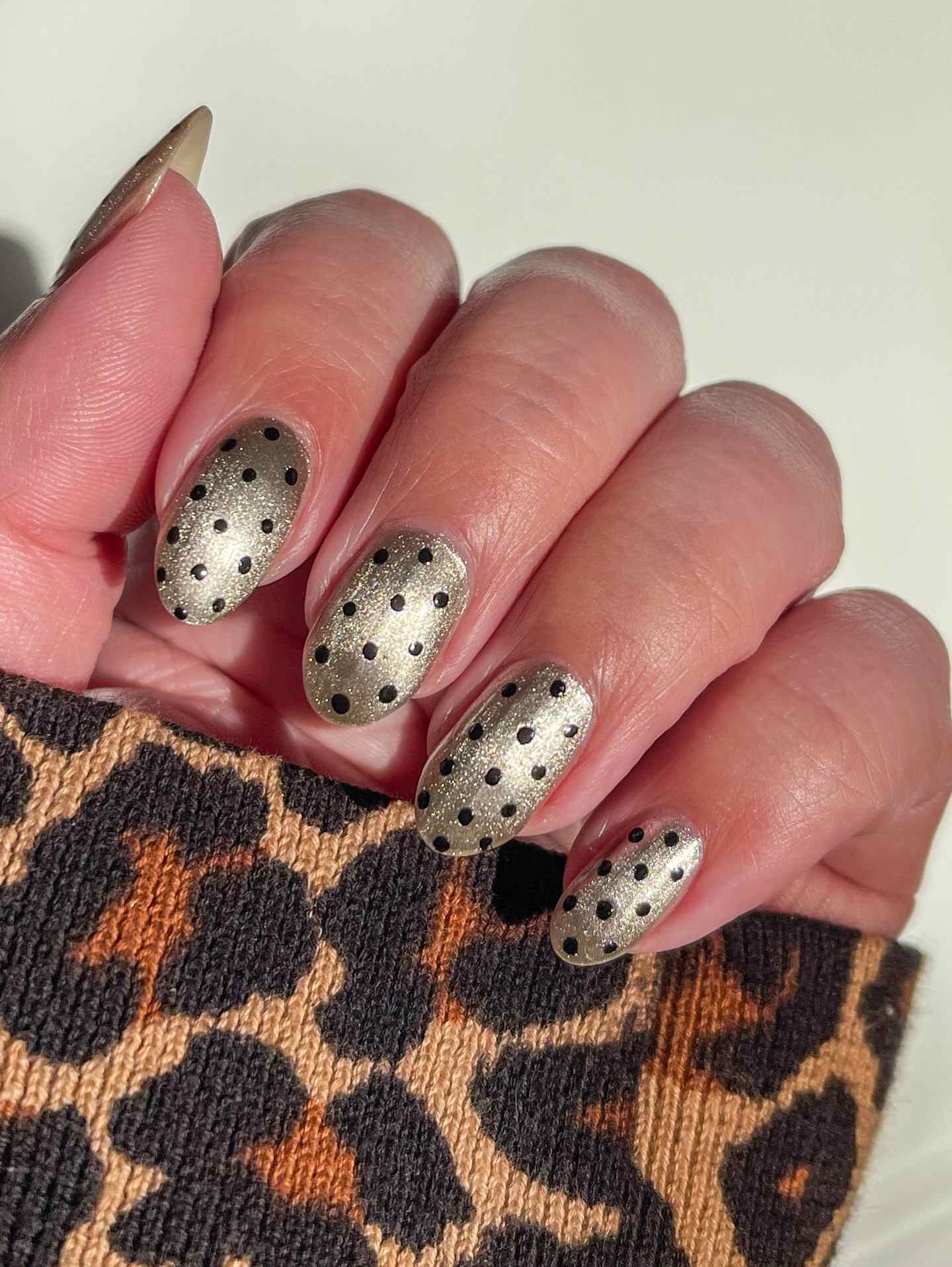 red with white polka dot nails, brown chrome polka dot nails, cateye almond nails, cat eye, yellow and blue