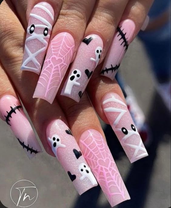 Short almond halloween nails with purple and black nail ideas and subtle design