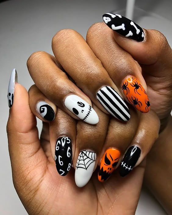 Cute halloween nail ideas with pumpkin face nails