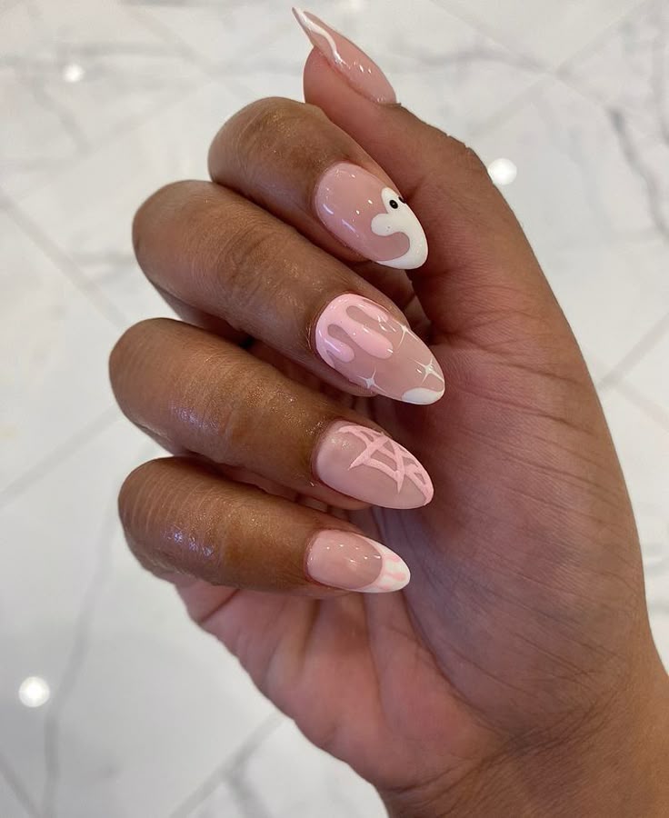 Subtle halloween nail art with pink ghosts