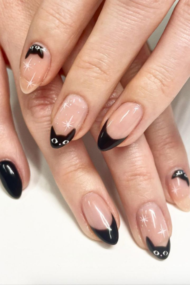 Orange black and white nails with cat design