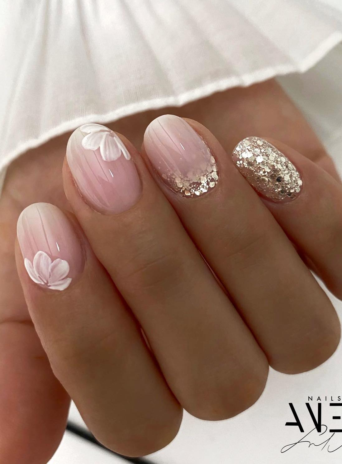 Bride nails wedding with neutral wedding nails, featuring elegant nude nails and sage green glitter.