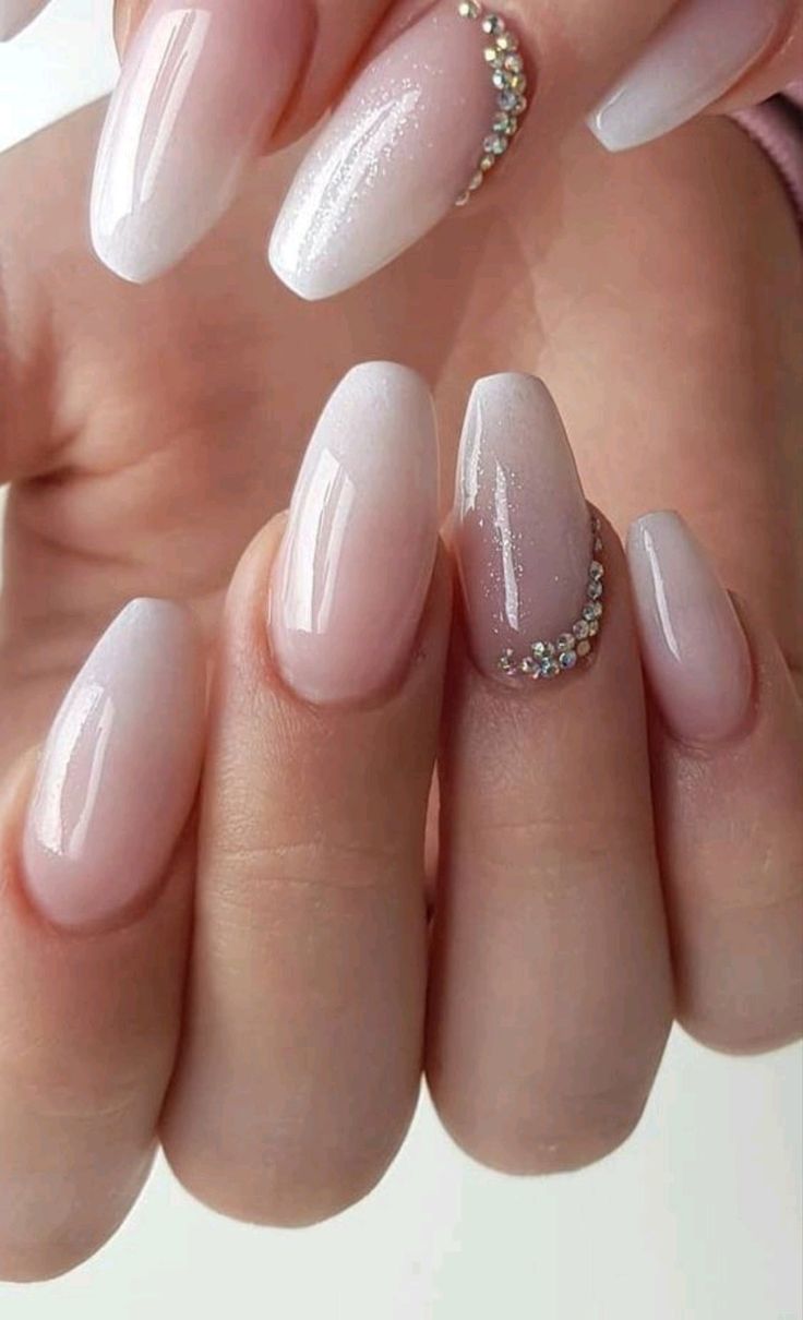 Almond wedding nails with graduation nails, showcasing engagement nails for the bride in floral designs.
