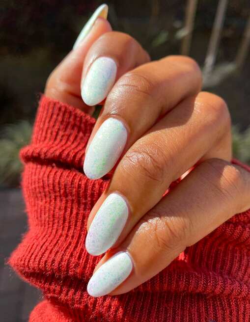 Milky white French tip nails with red white nails, nude chrome nails, black and flower.