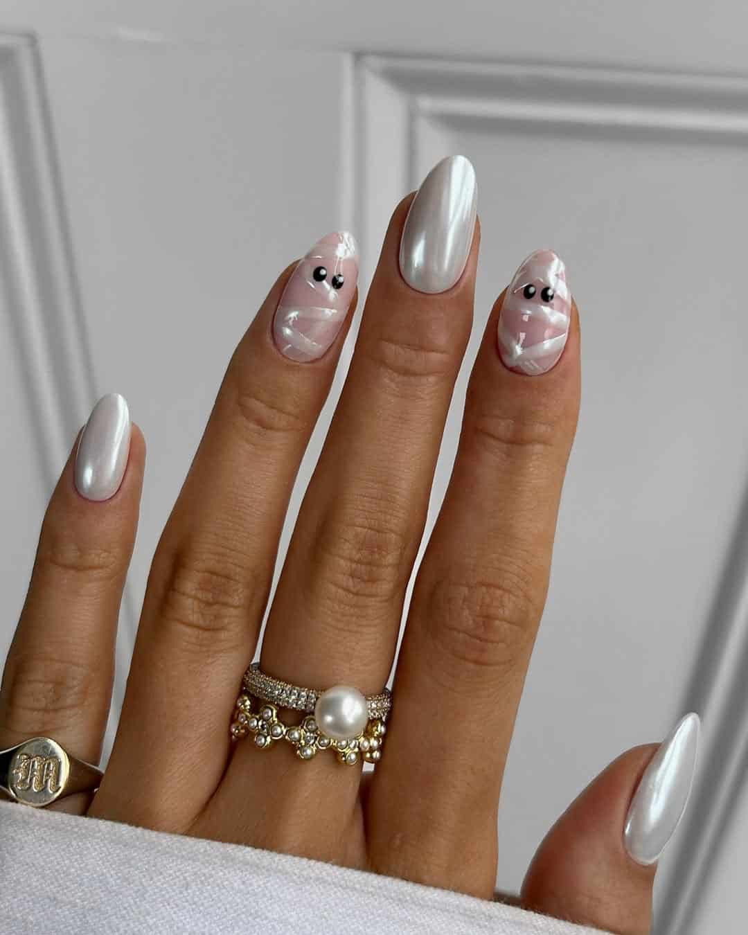 Pearl white nails with ghost motifs