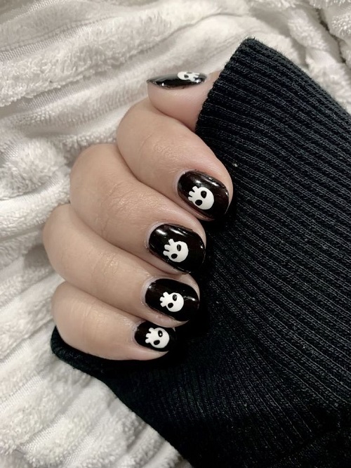 Black nails with white ghost designs