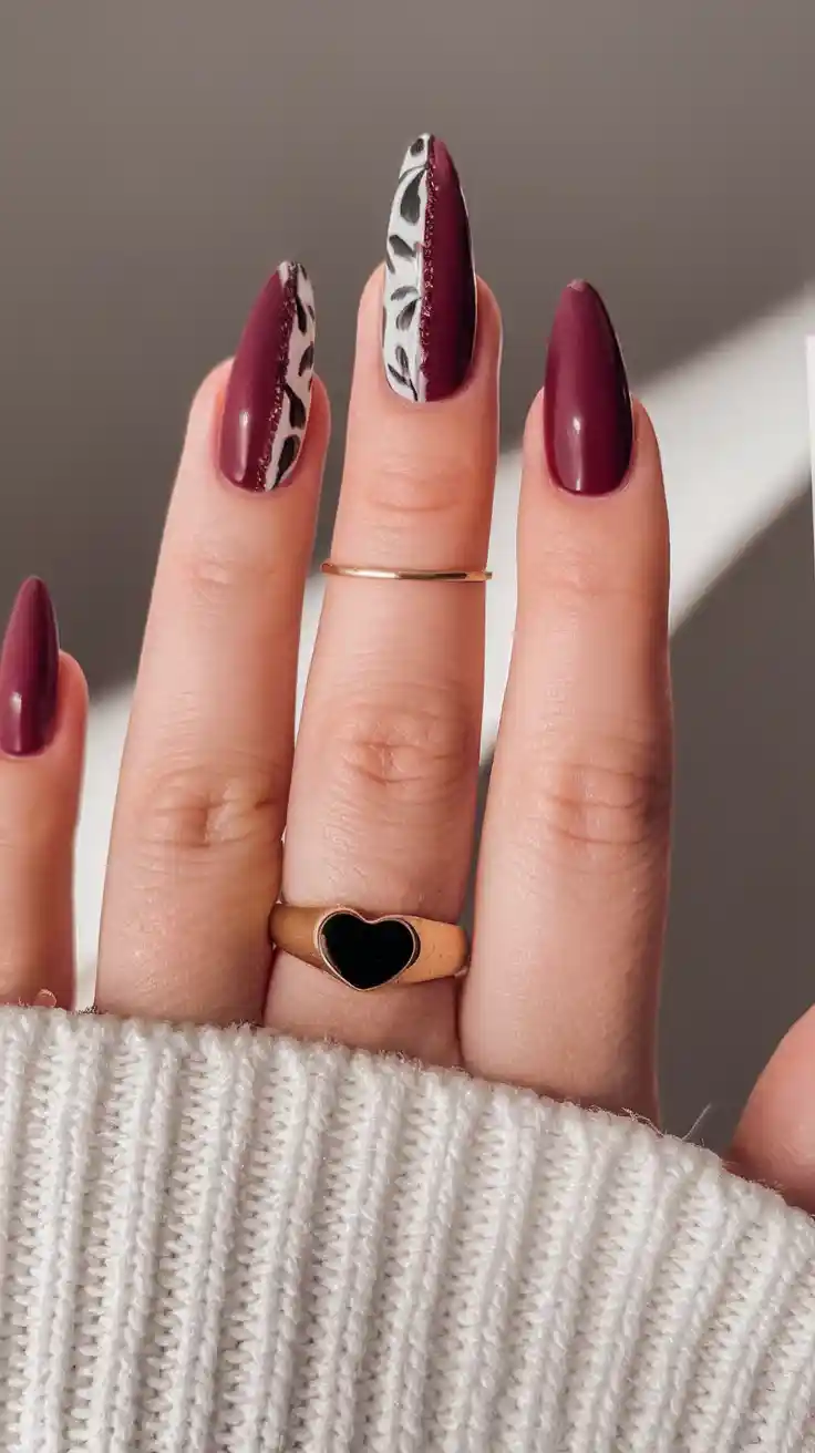 Burgundy nails with black and white accents