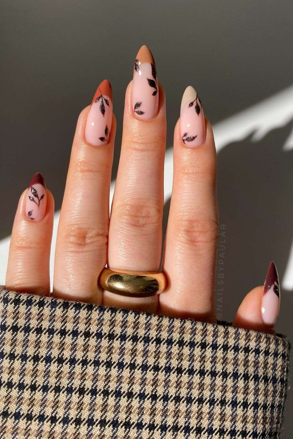 Nails with leaf art and earthy tones
