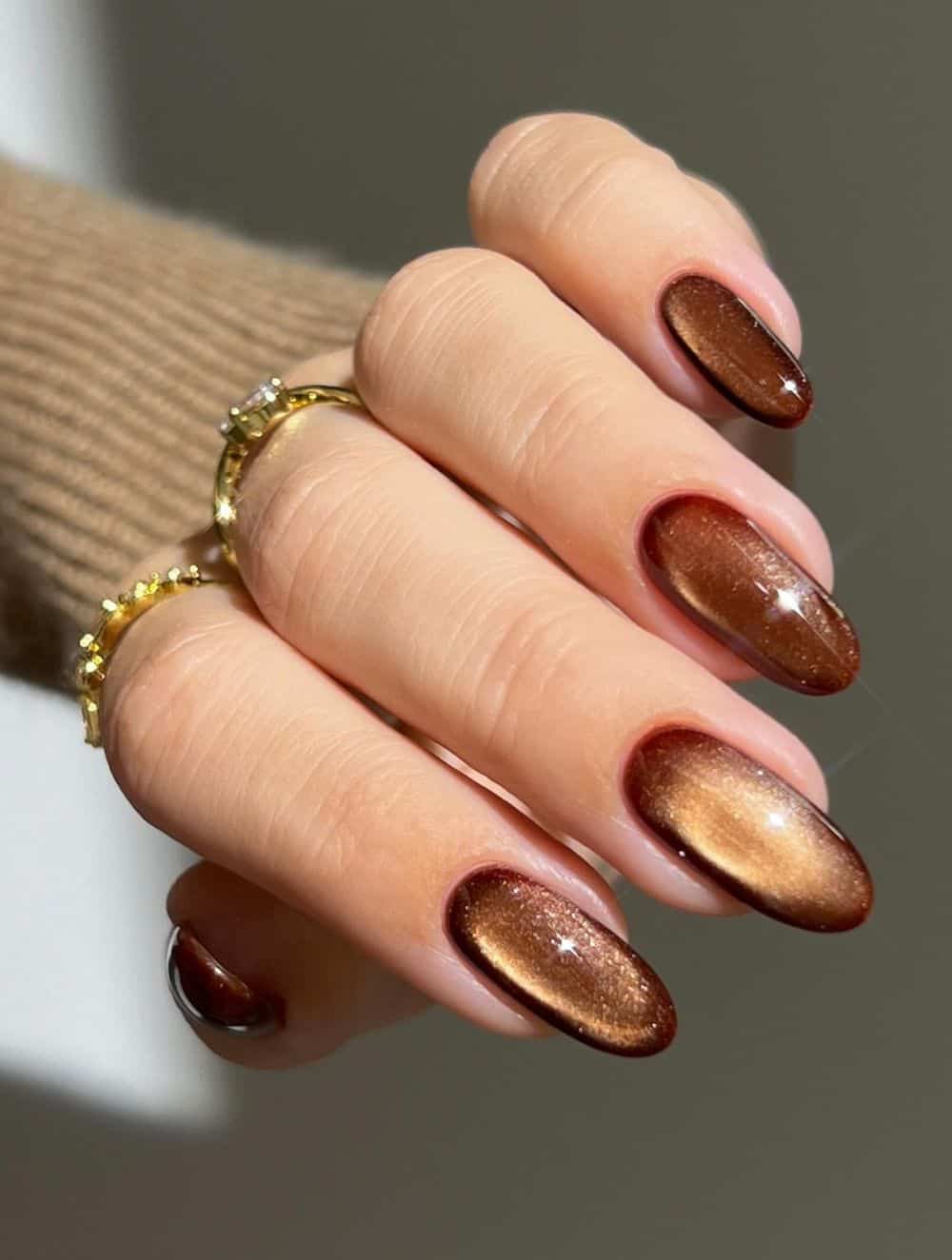 Bronze shimmer nails with oval shape
