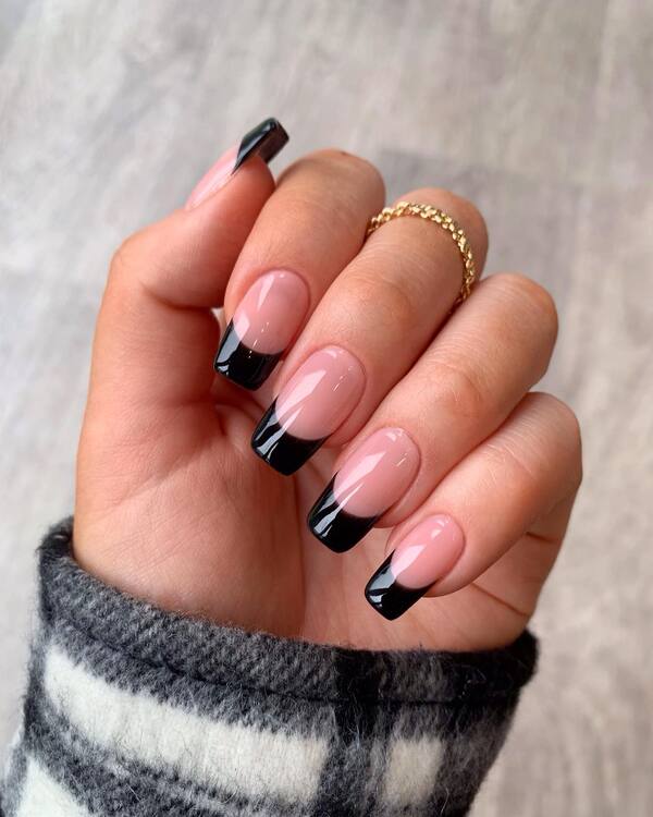 Black French tip nails with almond shape