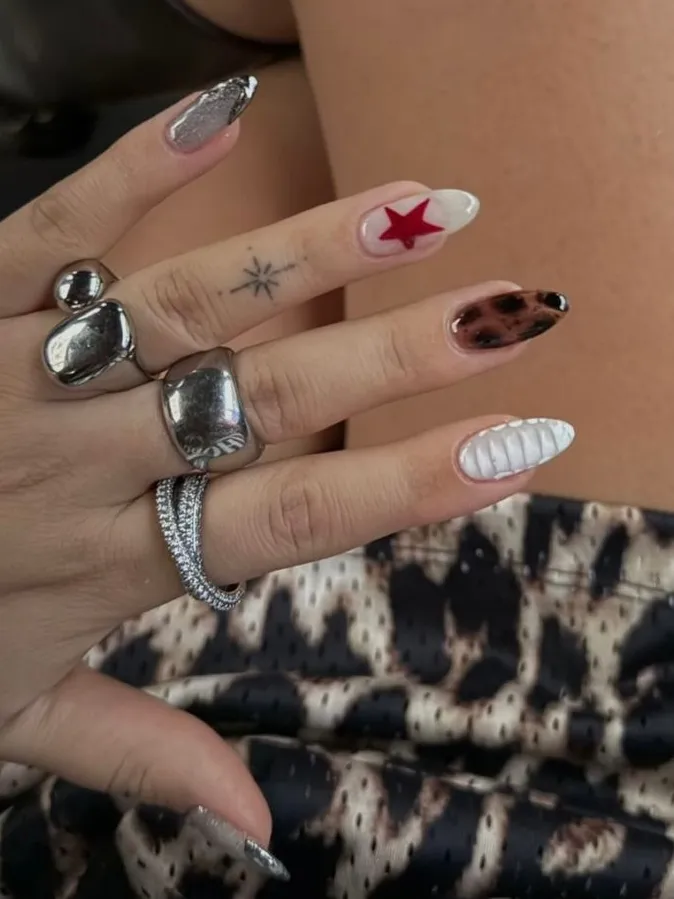Mixed pattern nails with a bold red star.