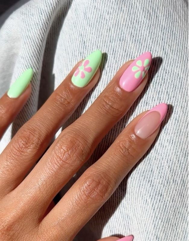 Pastel flowers on color-blocked almond nails.