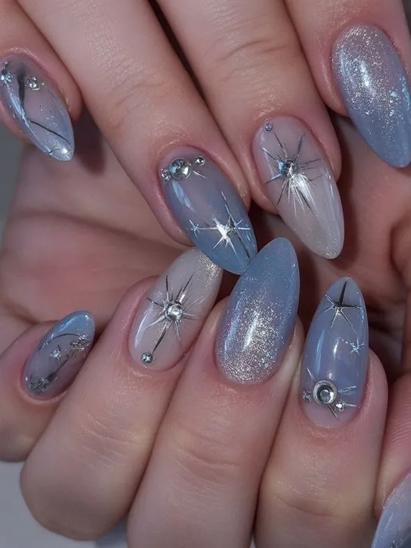 Almond nails with sparkling blue accents.