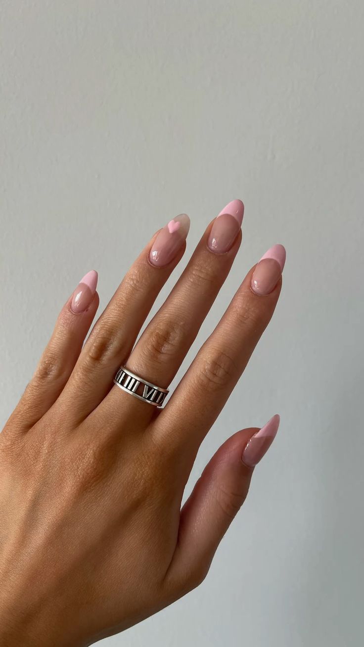 Pink almond nails with soft tips.