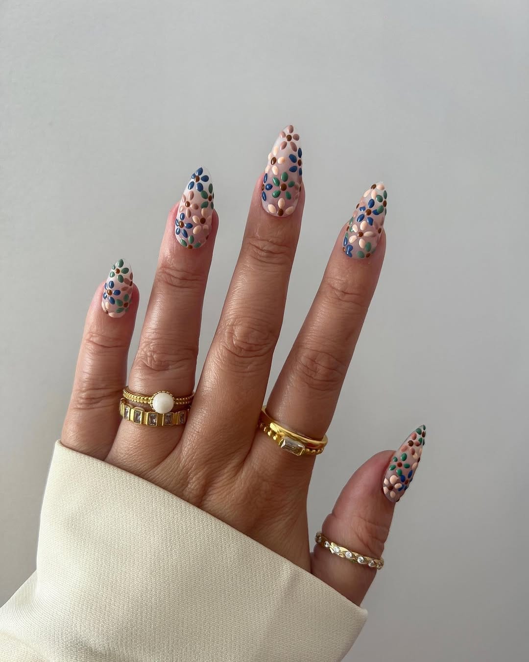 Playful confetti almond nails with colorful dots