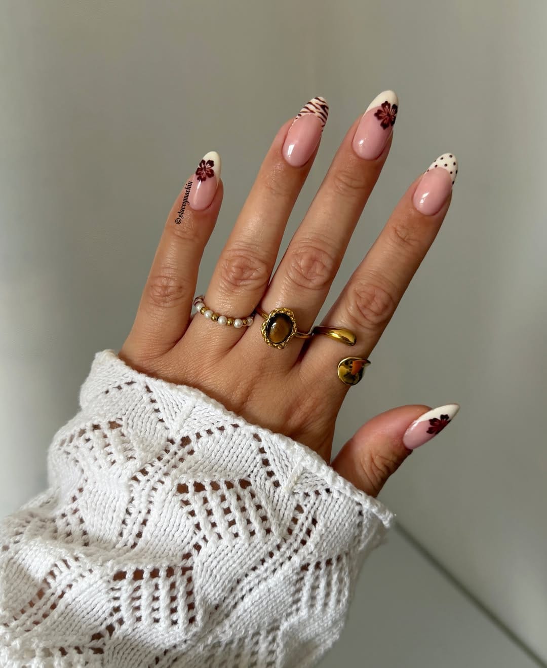 Floral French almond nails with delicate pink base