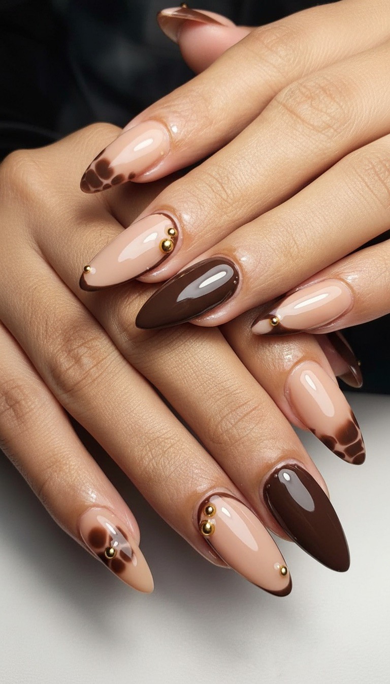 Chocolate marble almond nails with gold accents