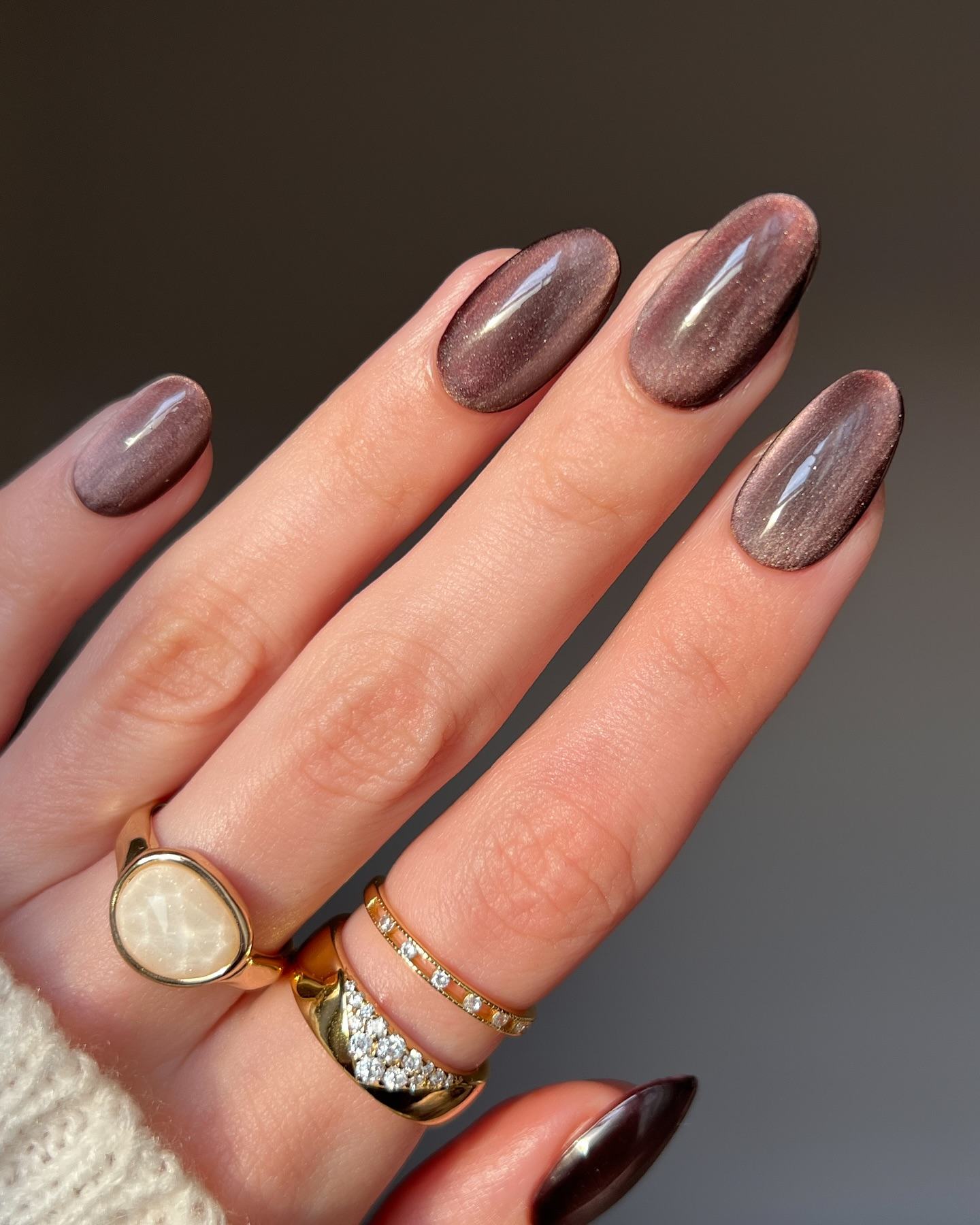 Smoky plum almond nails with shimmer finish