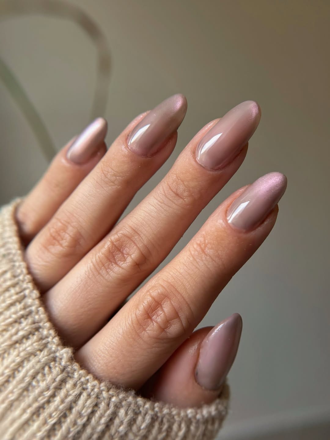 Classic nude almond nails with glossy finish