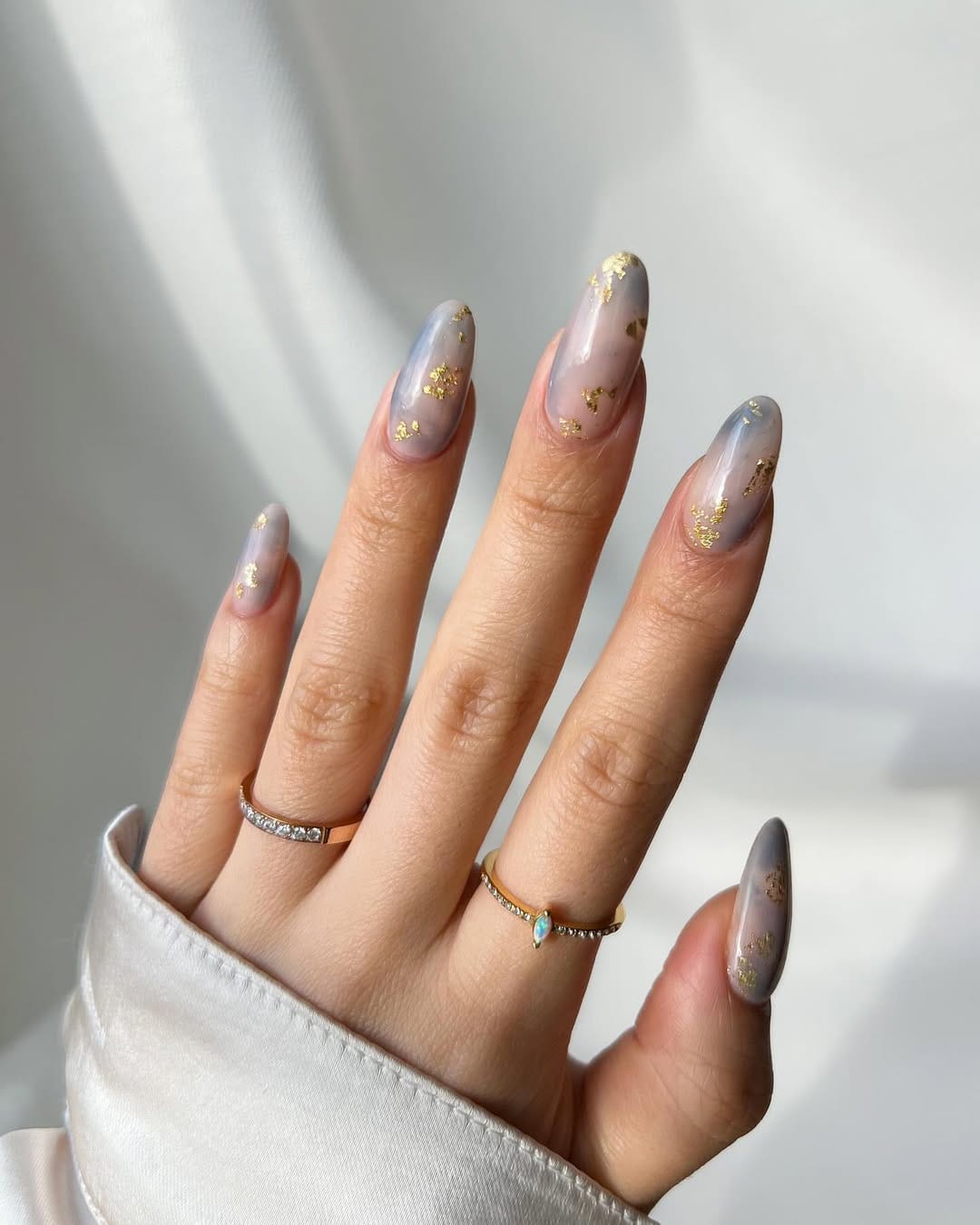 Gold-tipped ombré almond nails