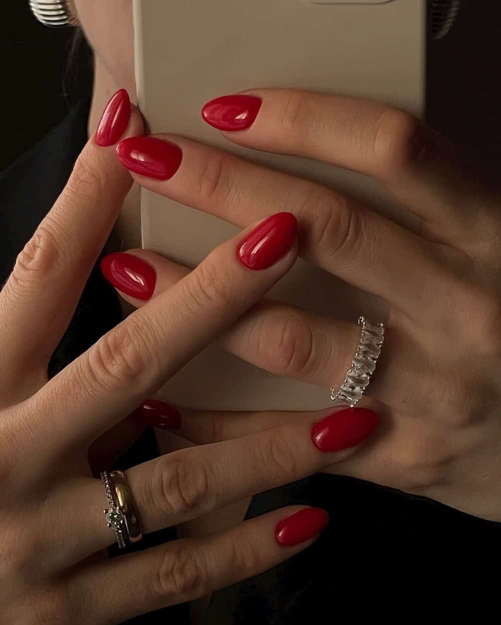 Classic red almond nails with glossy finish