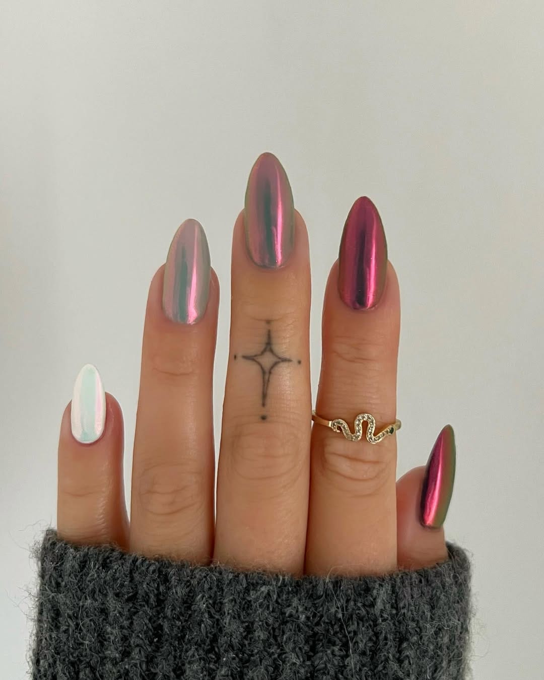 Metallic ombré almond nails with reflective finish