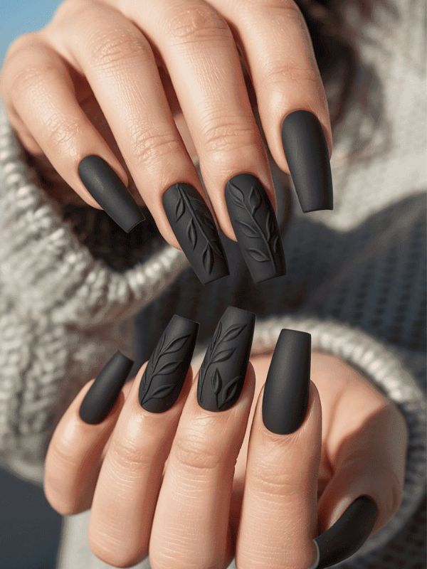 Matte black nails with leaf texture, bold fall nails