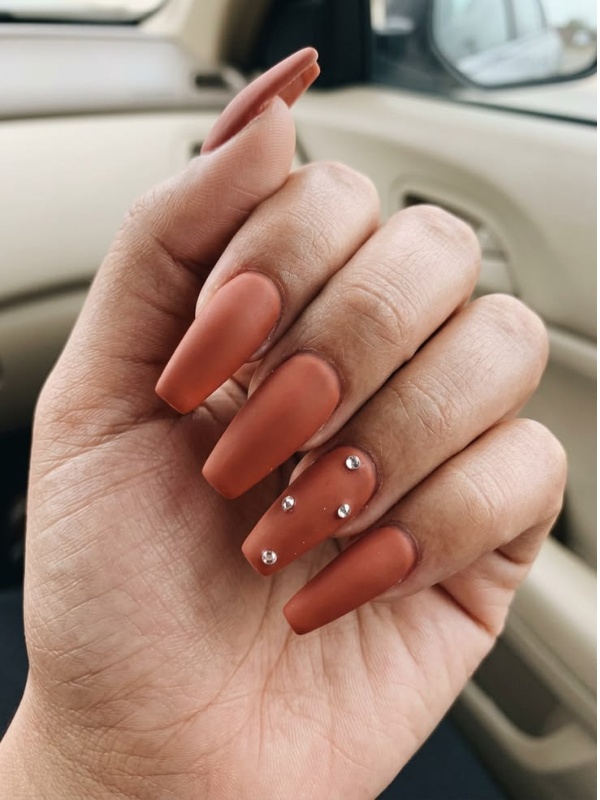 Matte terracotta nails with rhinestones, elegant autumn look
