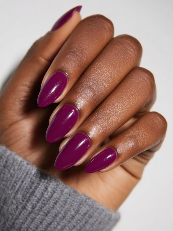 Rich plum nails in almond shape, fall nail design