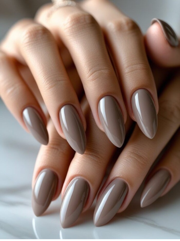 Glossy taupe almond nails, chic and versatile