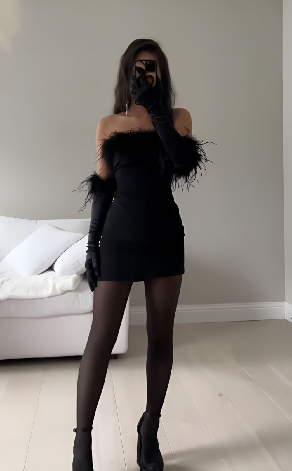 Black mini dress with feather details for night out
