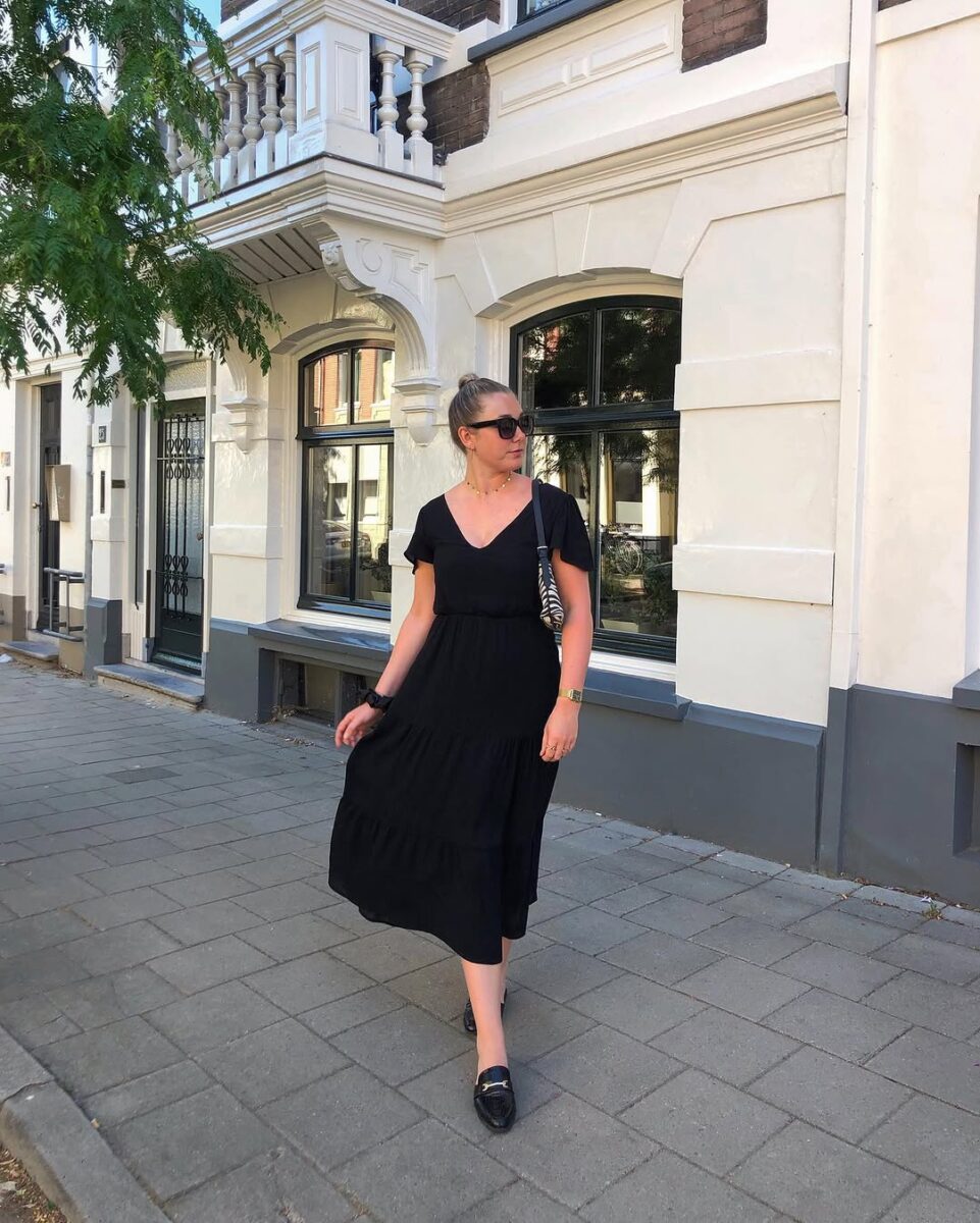 Black midi dress with loafers for day look