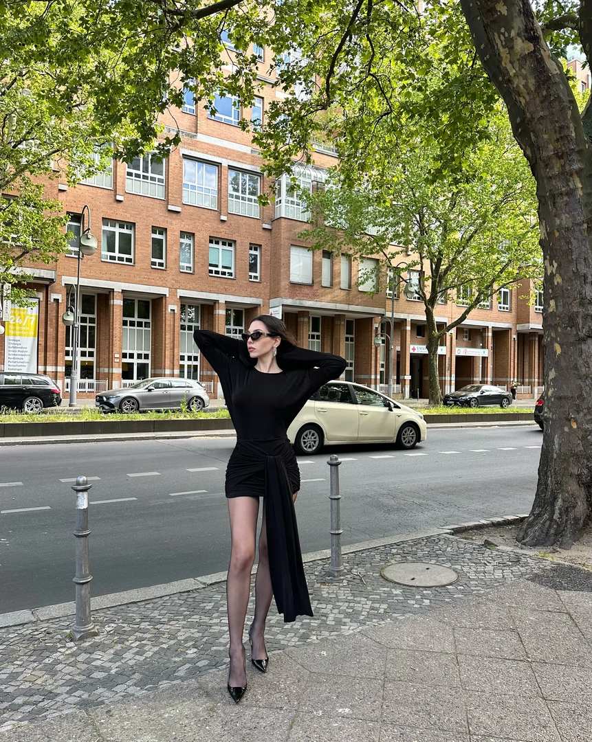 Black dress with dramatic sash for city style