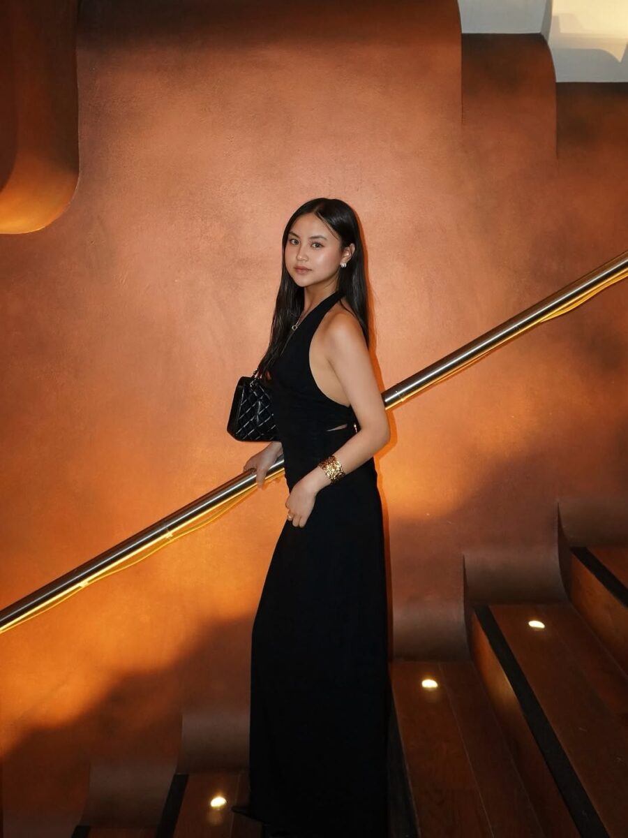 Black maxi dress with minimal accessories for evening event