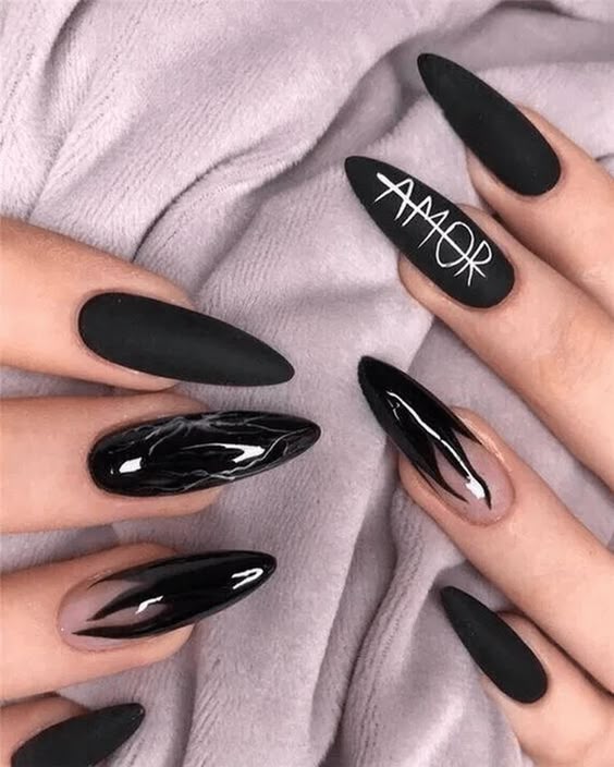 Black matte and glossy stiletto nails with 'Amor' text