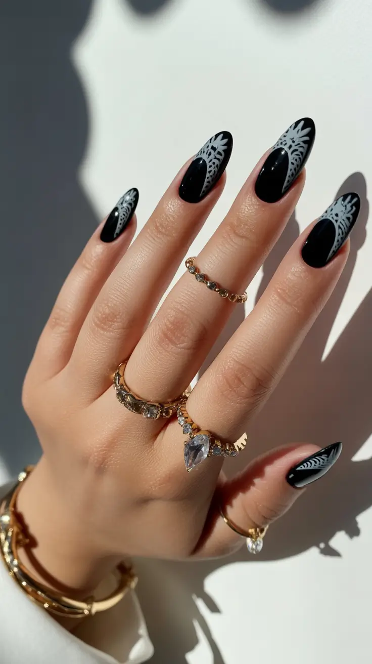 Black almond nails with white lace design