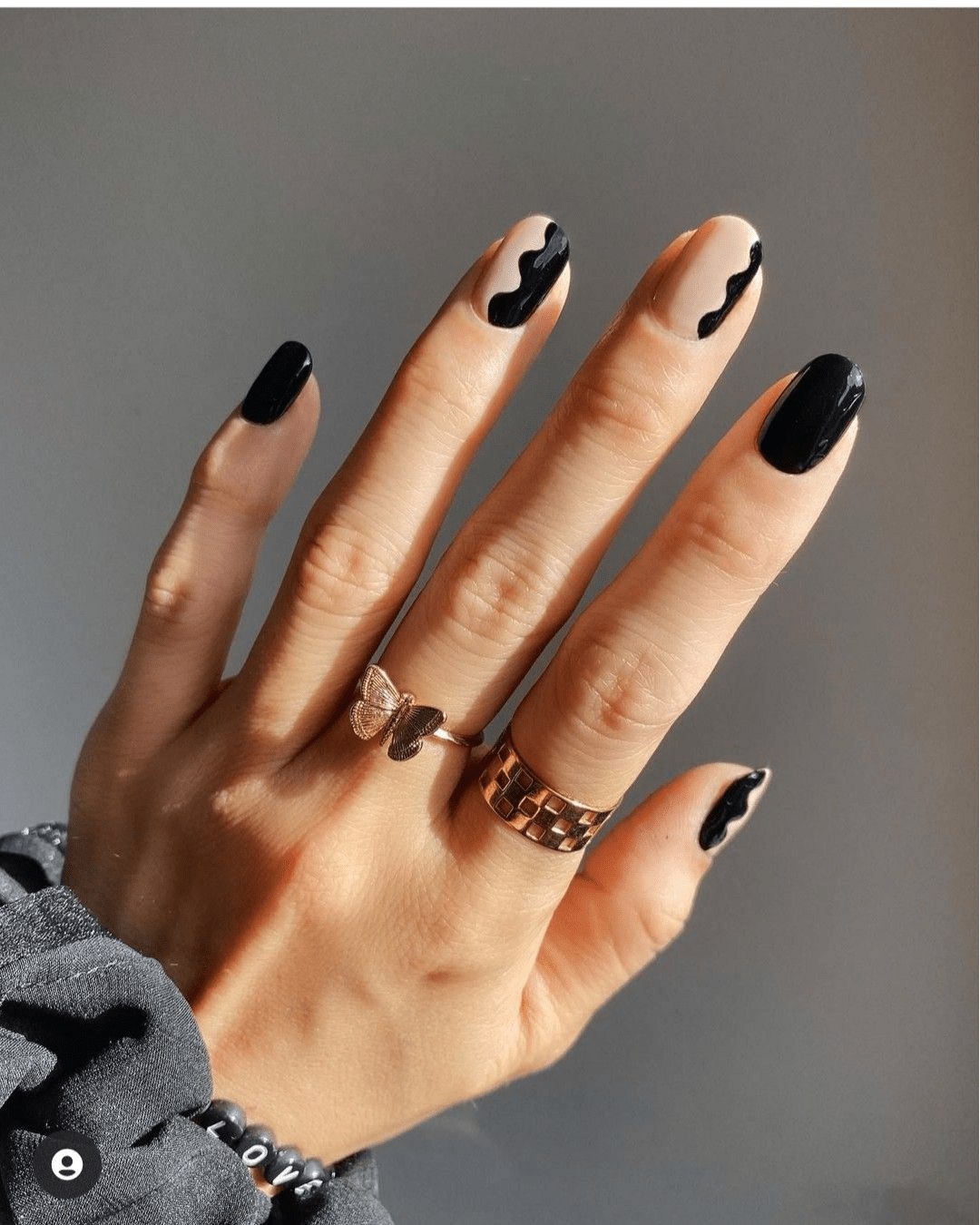 Long black nails with abstract nude art