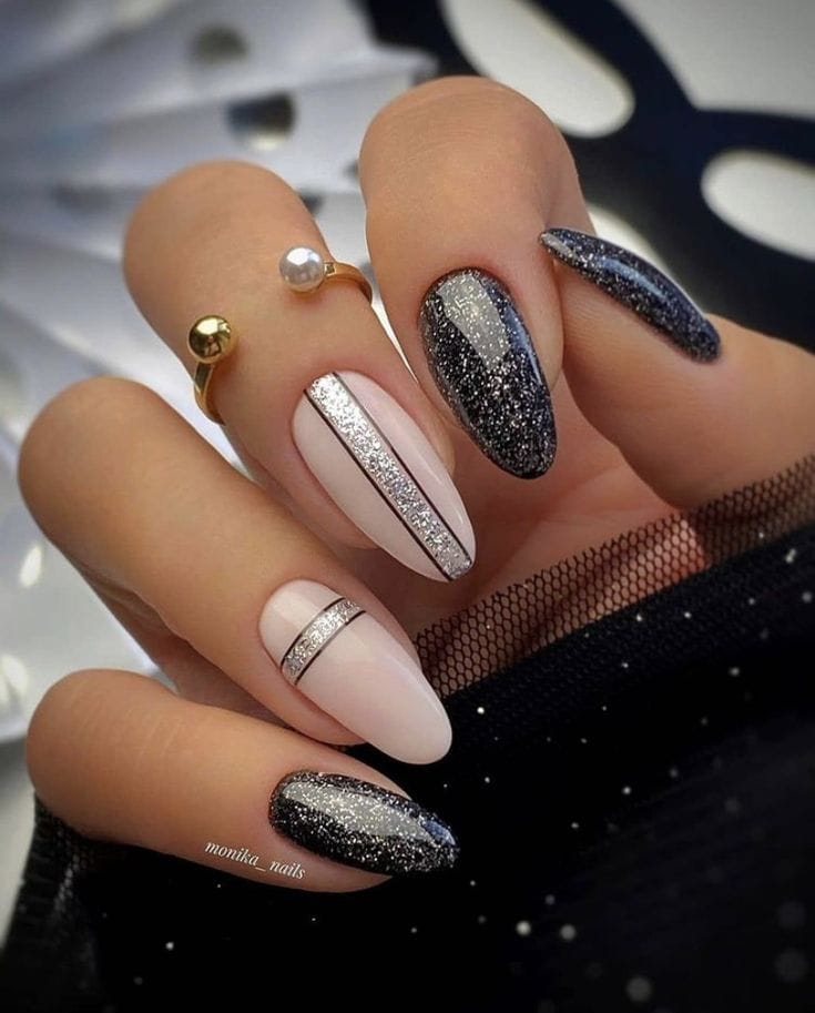 Glitter and black almond nails