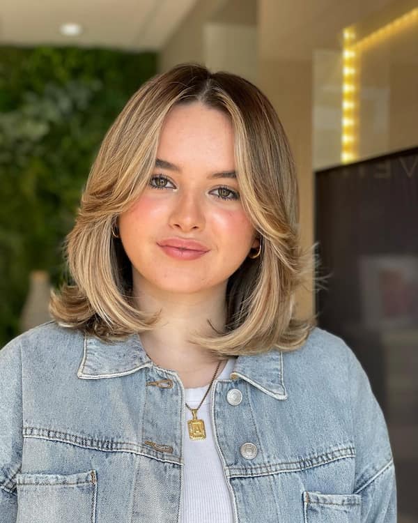 Layered bob with curtain bangs for boho chic style