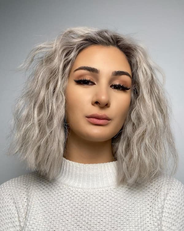 Silver bob with tousled texture for edgy sophistication