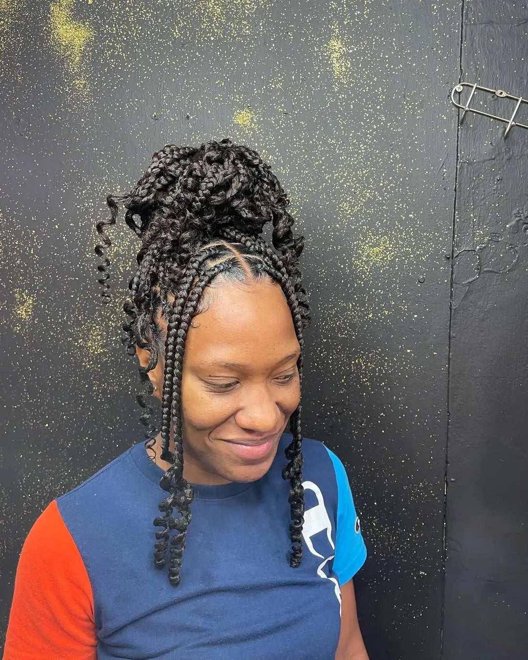 High bun with box braids and curls