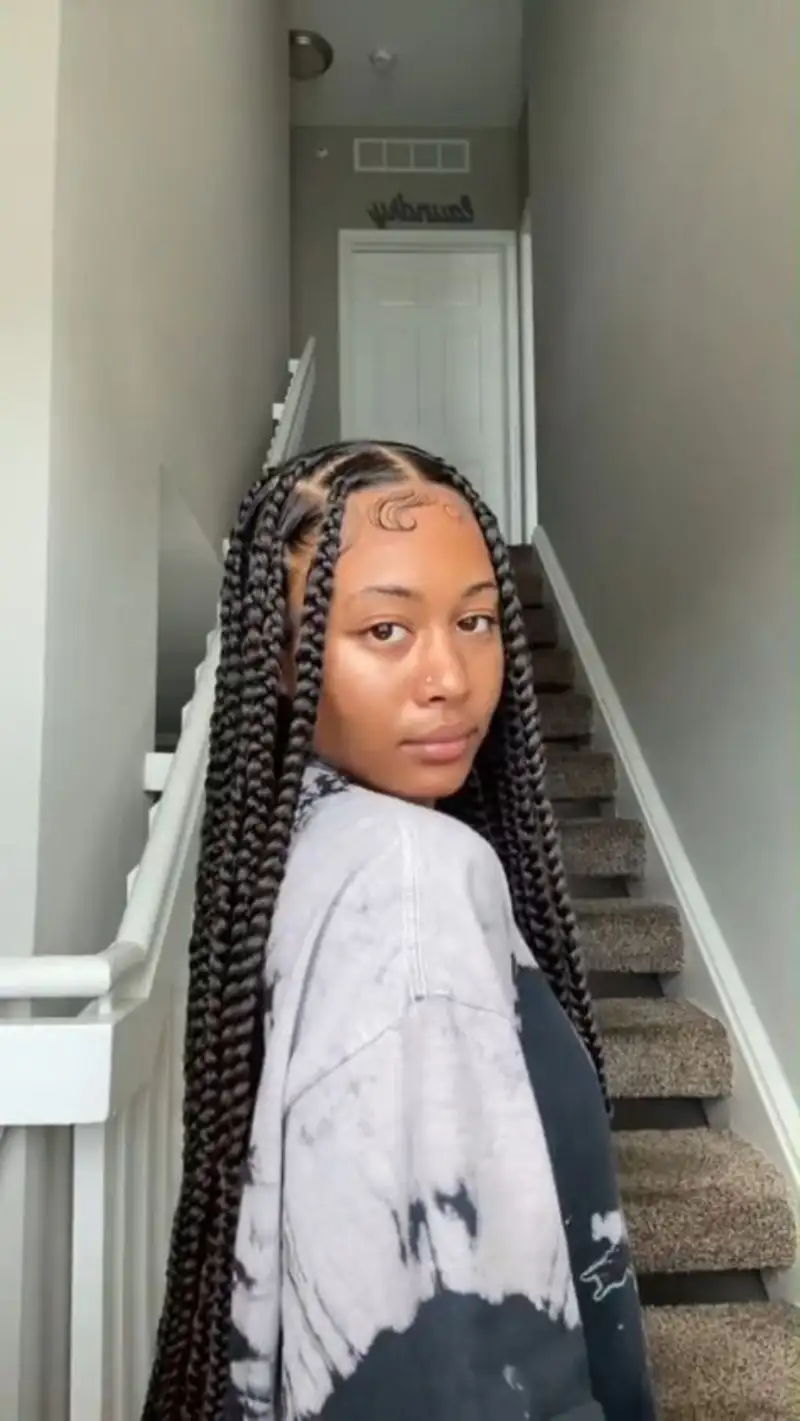 Long box braids with styled baby hairs