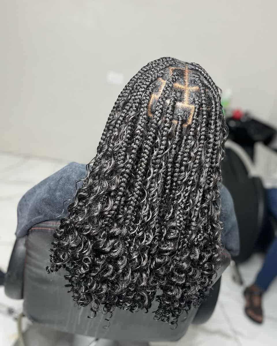 Medium box braids with curly ends