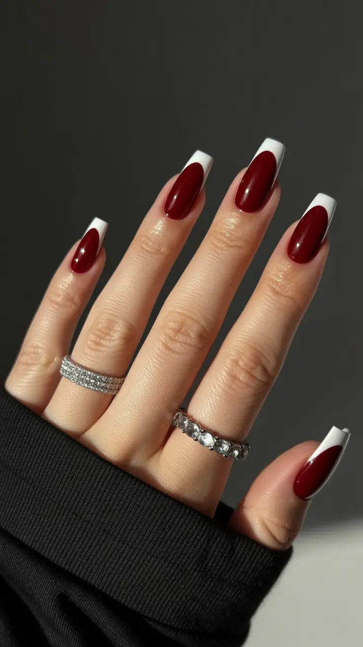 Burgundy nails with white French tips, elegant contrast