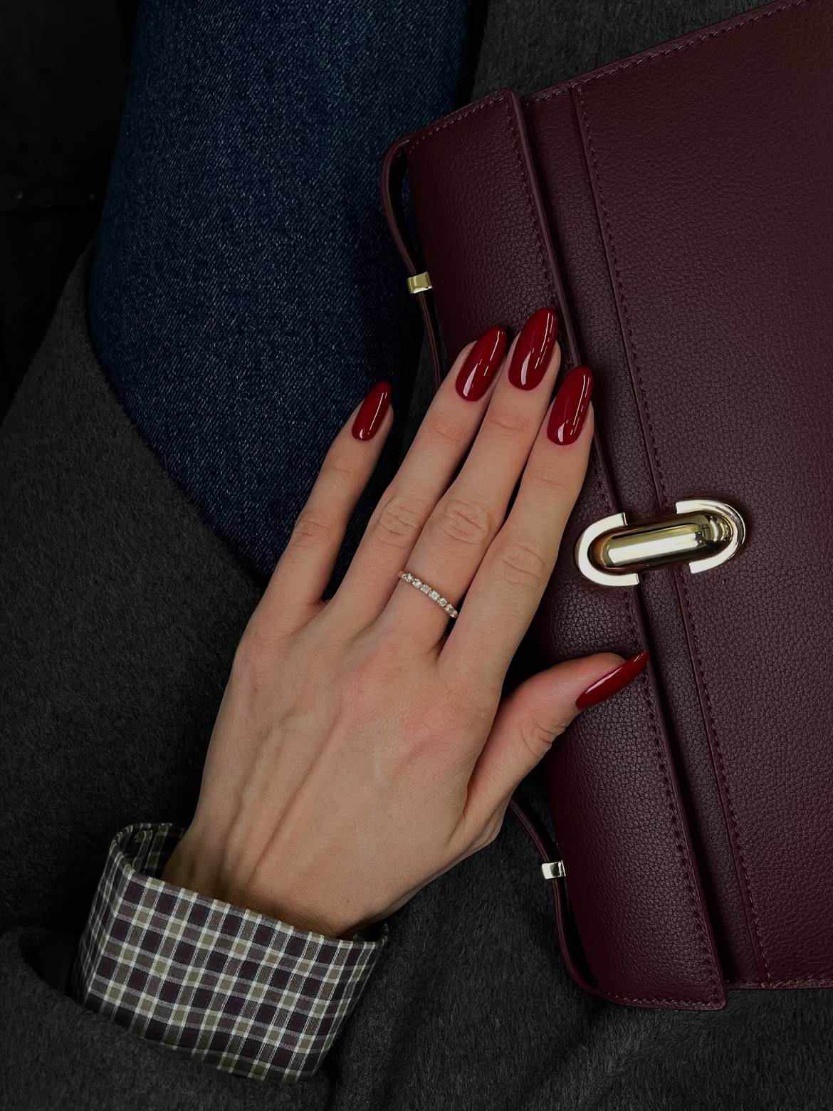 Luxurious burgundy nails with accessories, coordinated style
