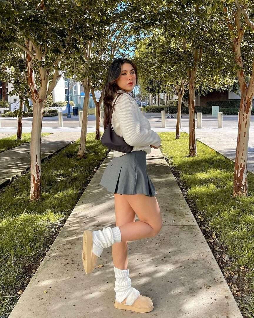 White sweater with grey skirt, youthful elegance