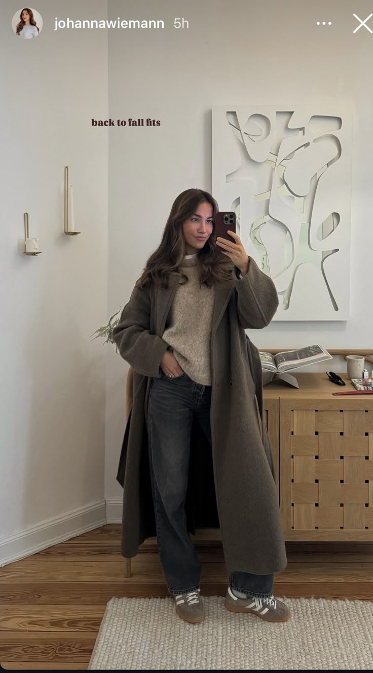 Long coat with knit sweater and wide-leg jeans