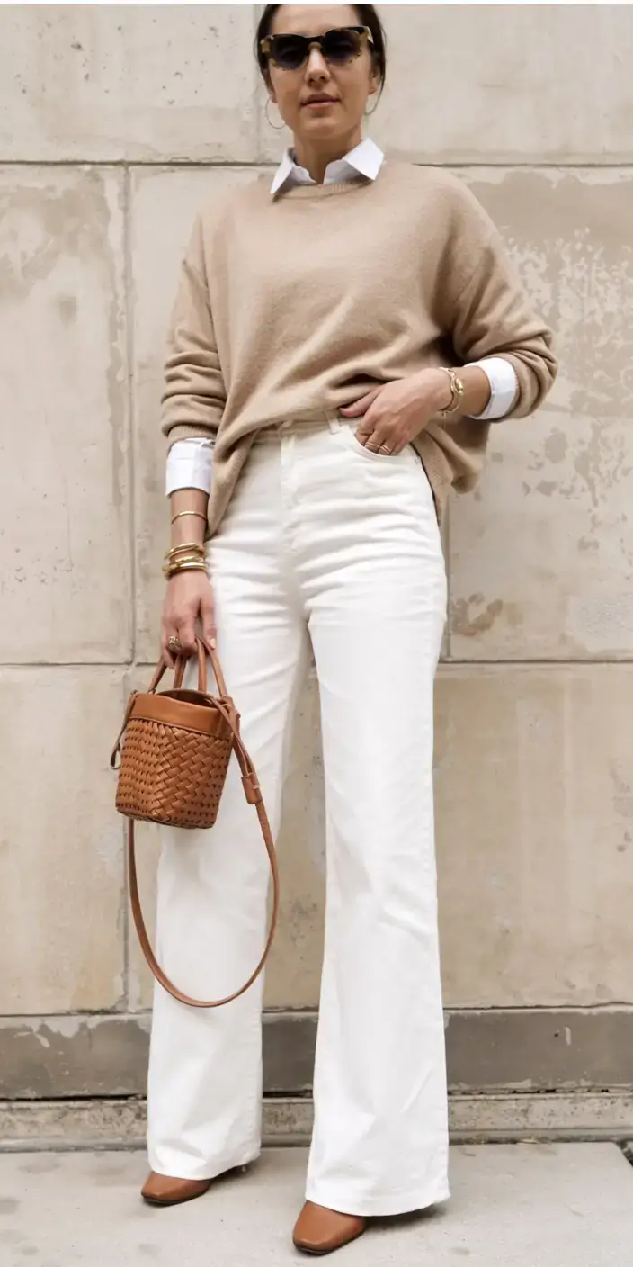 Beige sweater with white flared jeans