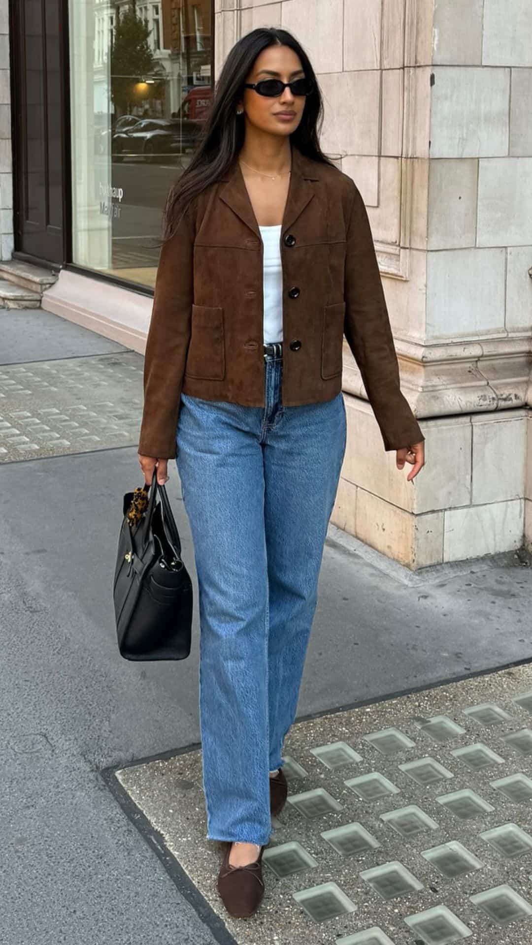 Brown jacket with straight-leg jeans