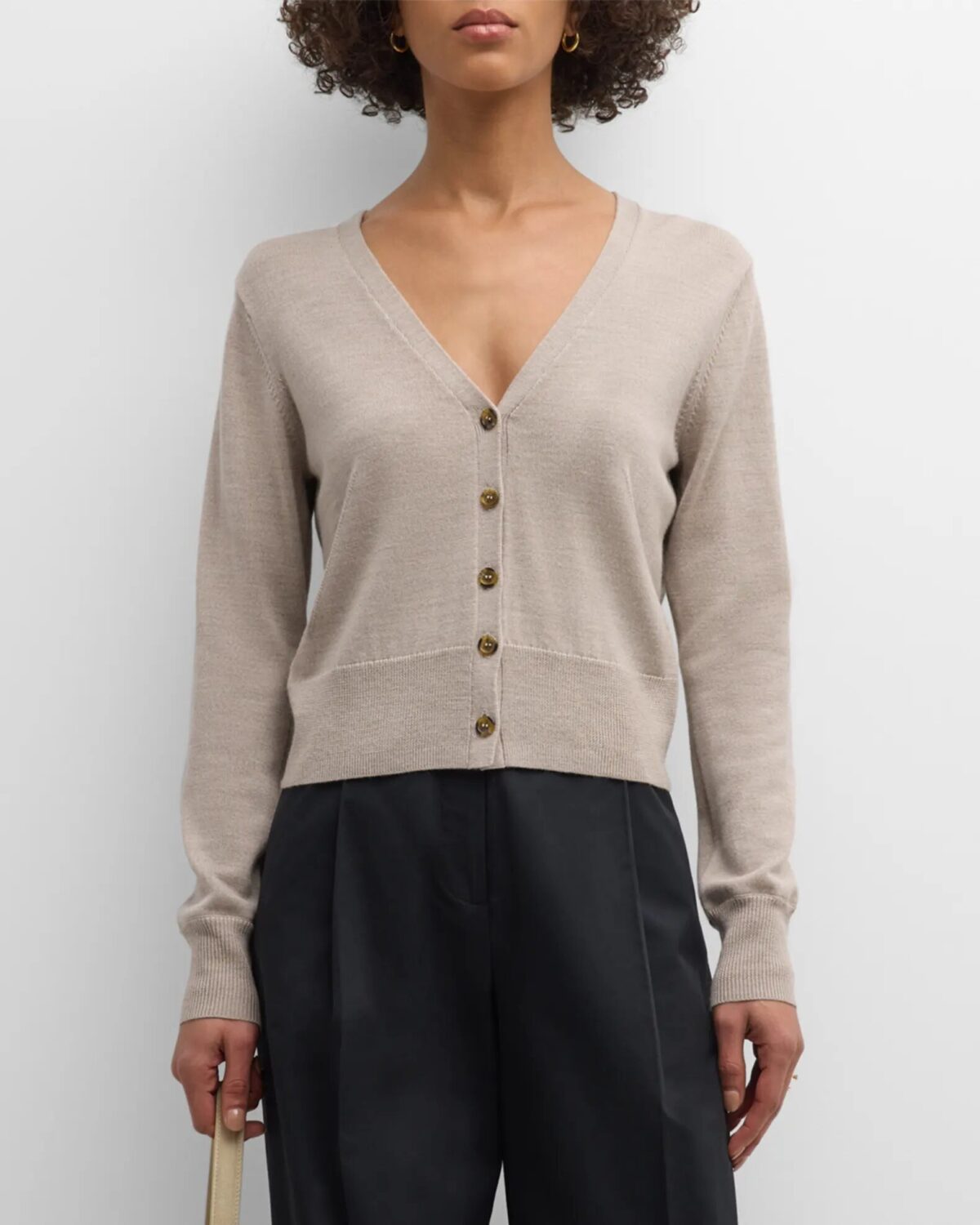 Beige cardigan with black trousers